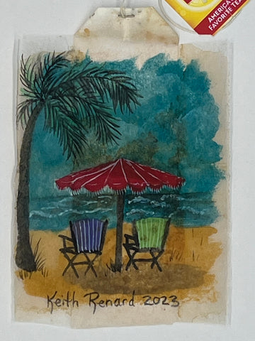 Chairs on the beach with Palm Tree