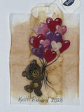Bear with heart balloons